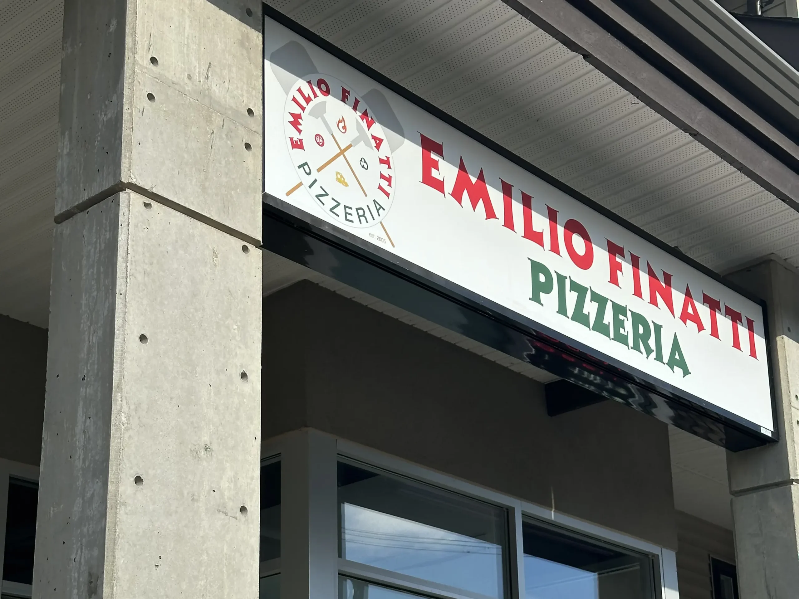An outside view of Emilio Finatti Pizzeria's Walnut Grove location, showcasing our shiny new sign.